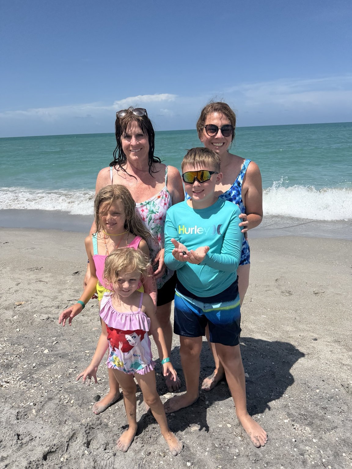 Family enjoying their shark tooth hunting adventure on the Gulf Coast